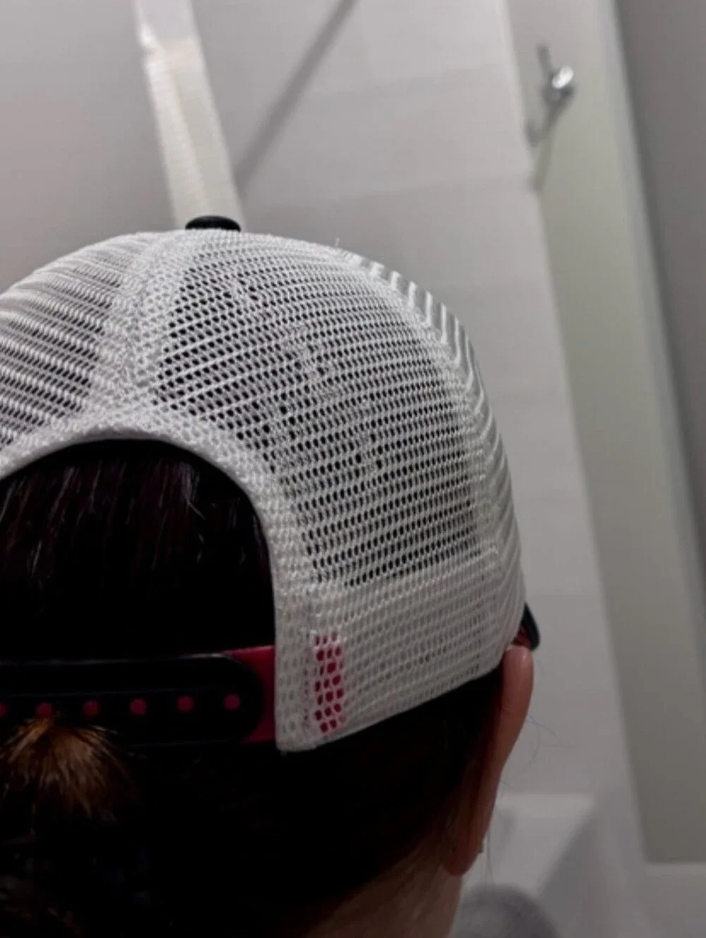 Saucony Black Running Hat with Red Patch and Pink Graphic Lines